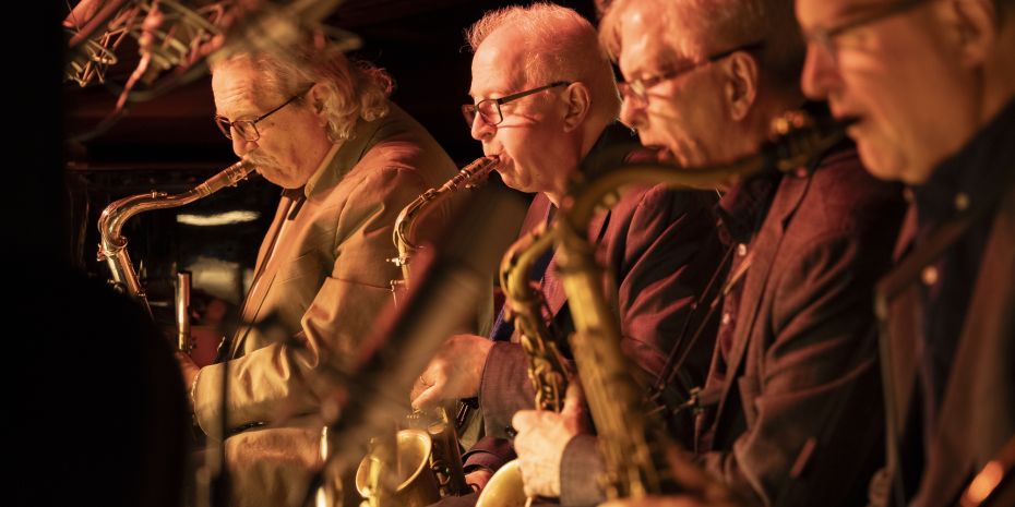 The saxophone section of the Vanguard Jazz Orchestra playing at the Village Vanguard.