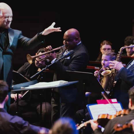 Conductor Jose Luis Dominguez conducts as soloist Terell Stafford on trumpet and Dick Oatts on saxophone perform with the Temple University Studio Orchestra