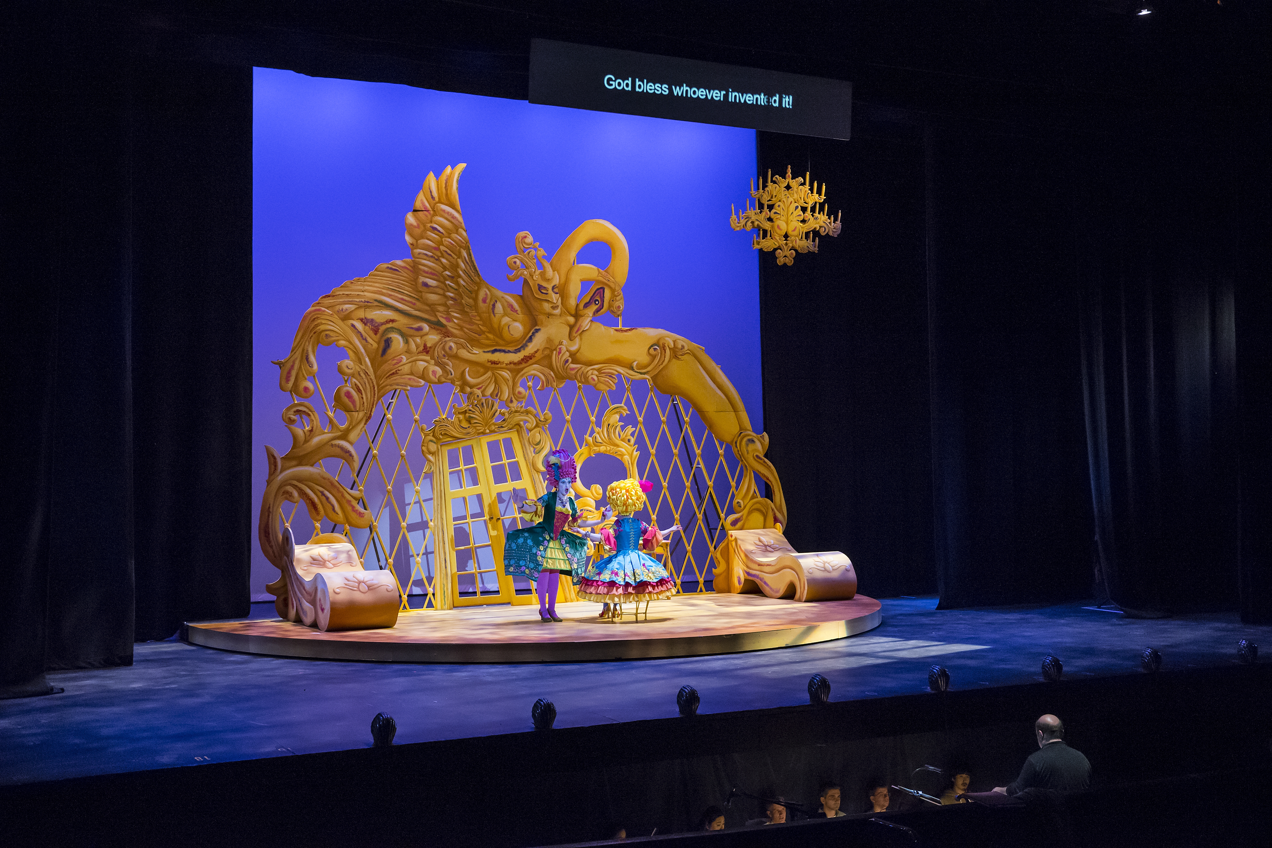 image of the Tomlinson stage with two females students singing during an opera production