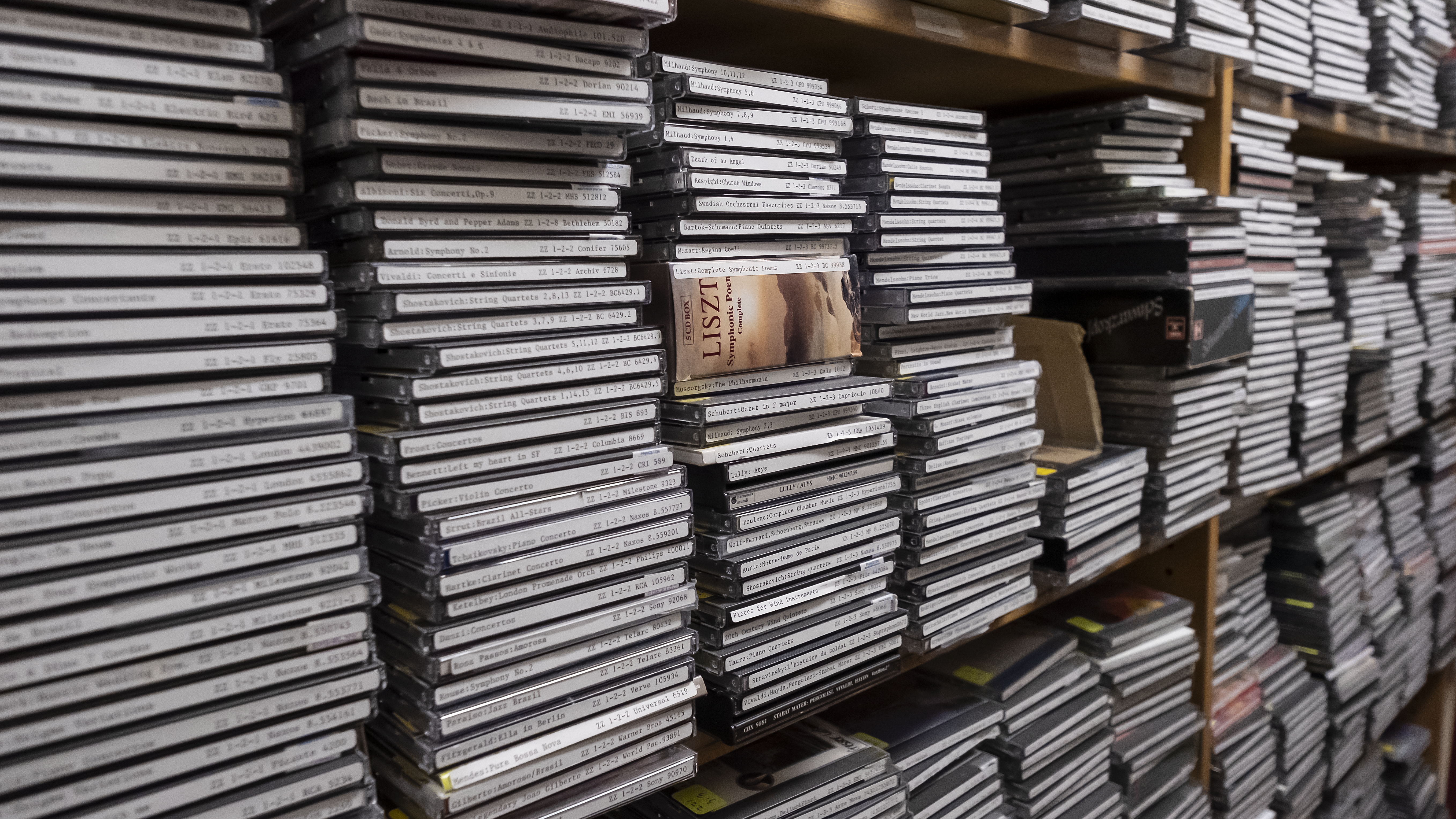 Stacks of CDs on shelves