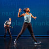 Three dancers on stage with blue background