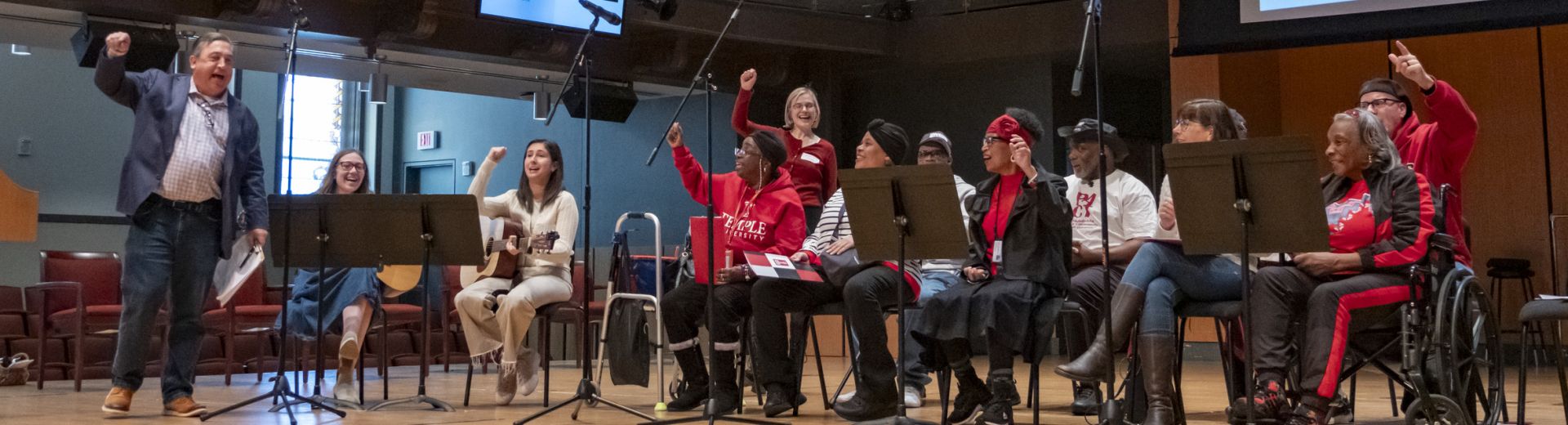 Photo of choir members on stage performing