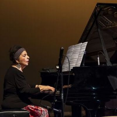 Maria del Pico Taylor sitting at a piano