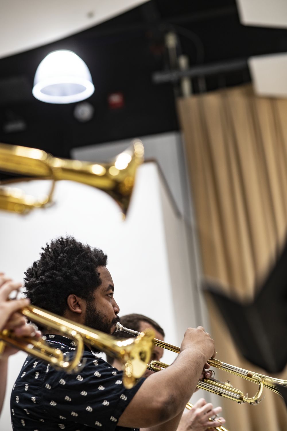 Photo of students playing trumpet in class