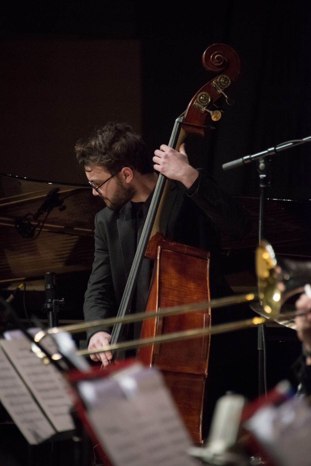 Photo of student playing upright bass in jazz band