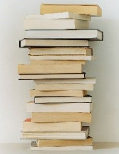 Stack of books against a white wall