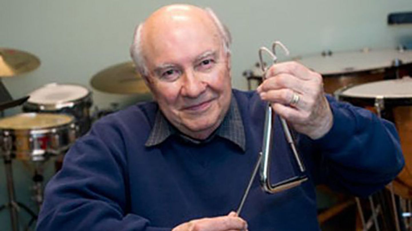 Alan Abel holding a triangle