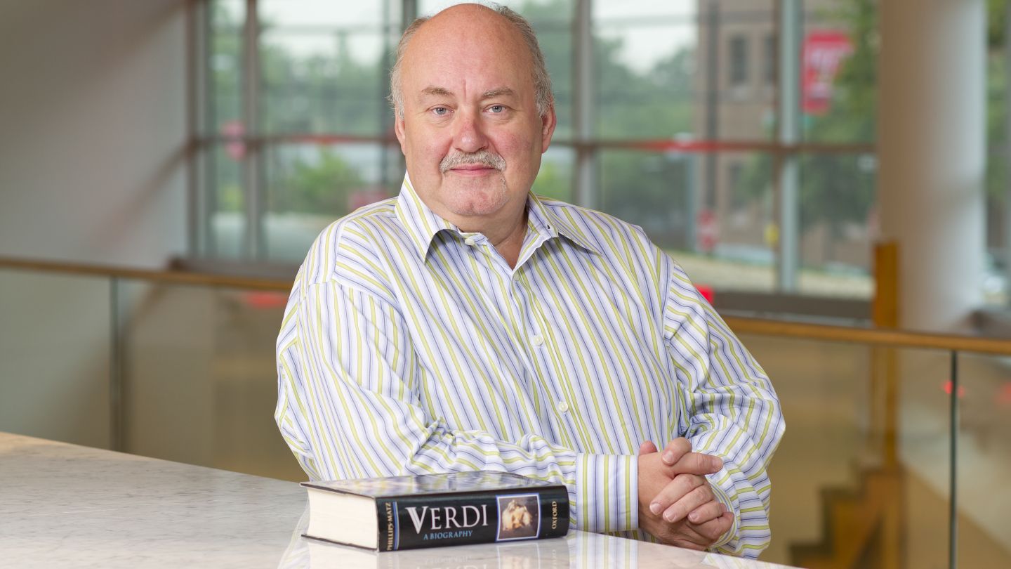 Image of Dr. Stephen Willier with a book